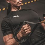 man in black nike crew neck t-shirt holding black sunglasses